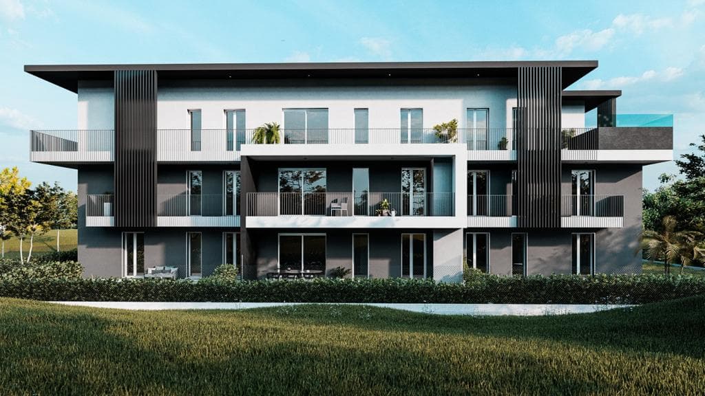Residenza Superga a Cornate d’Adda: render frontale della palazzina con balconi e prato